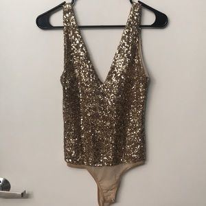 Gold sequins body suit. So cute!